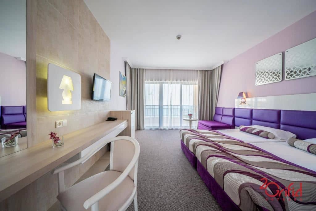 rooms-quad-deluxe-room-sea-view-balcony-or-terrace