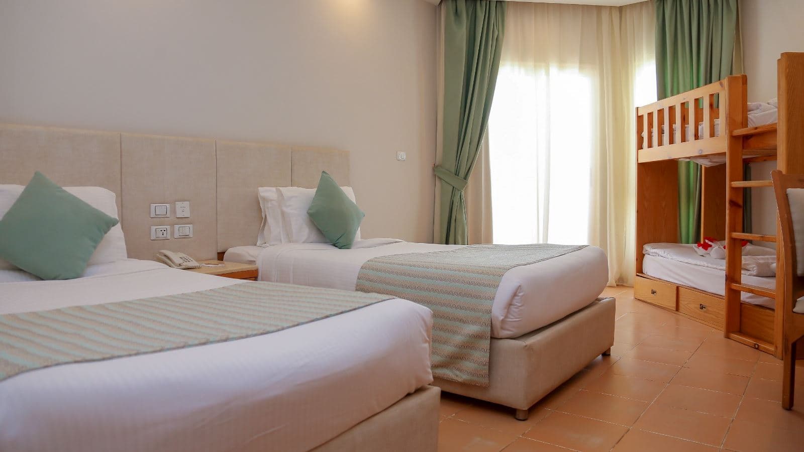 rooms-family-bunkbed-room-poolside-seabackgarden-view