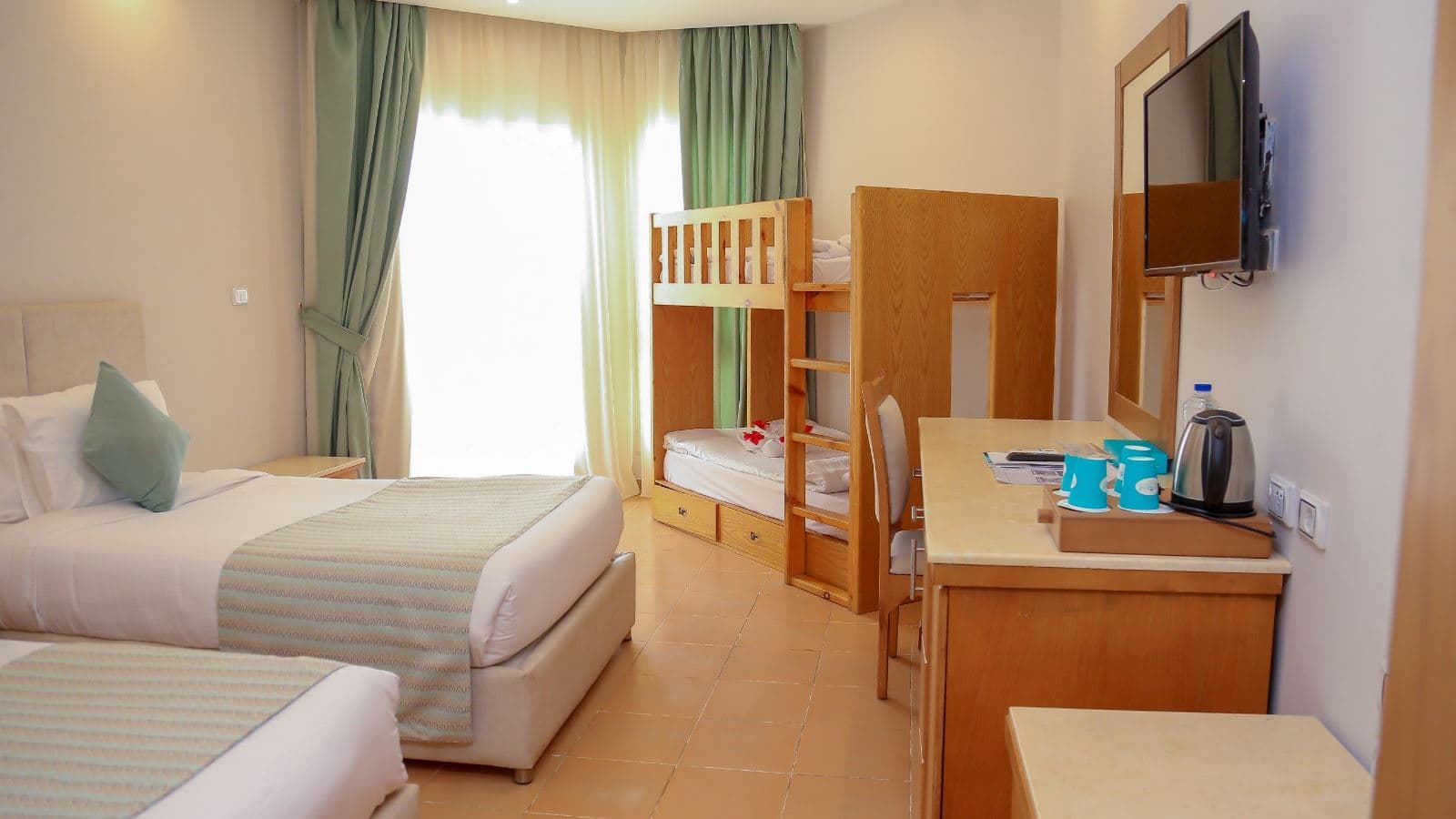 rooms-family-bunkbed-room-poolside-seabackgarden-view