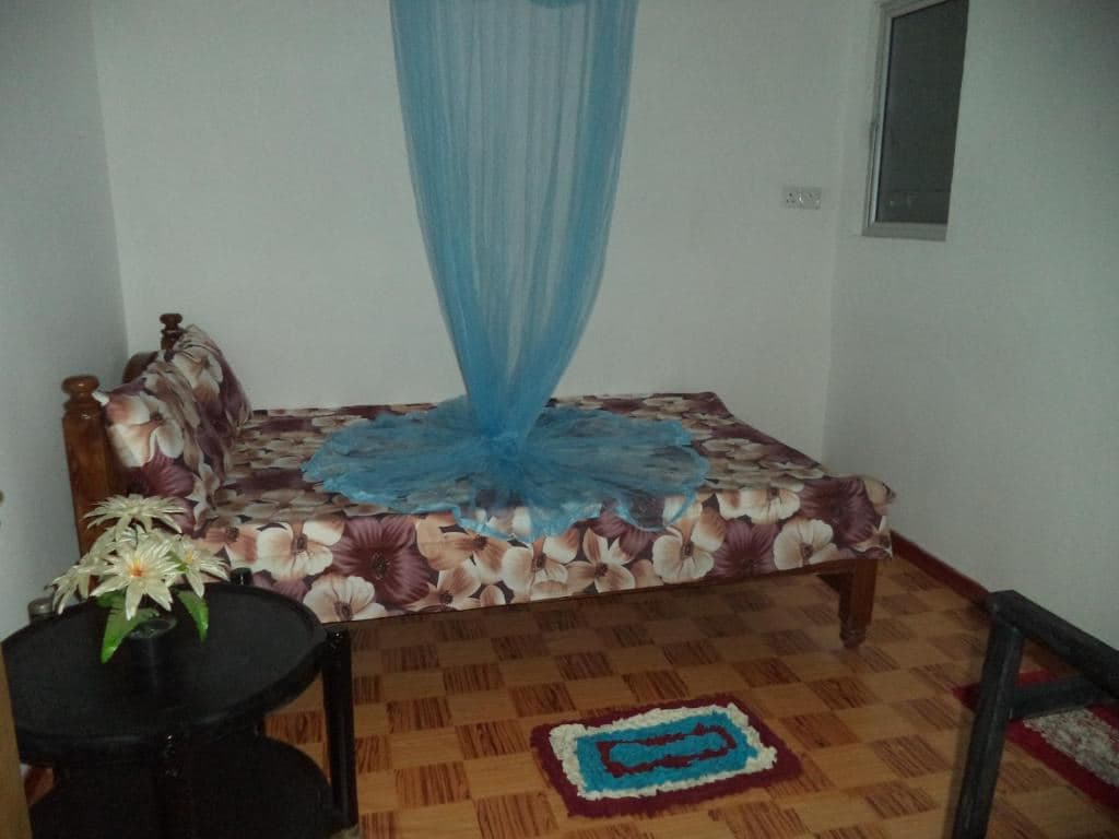 rooms-family-room-with-balcony-and-fan