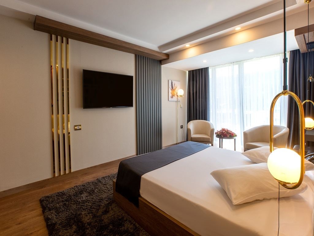 rooms-junior-suite-1+1-balkonlu-bahce-manzarali