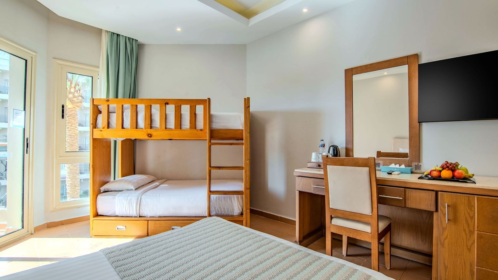 rooms-family-bunkbed-room-poolside-seabackgarden-view