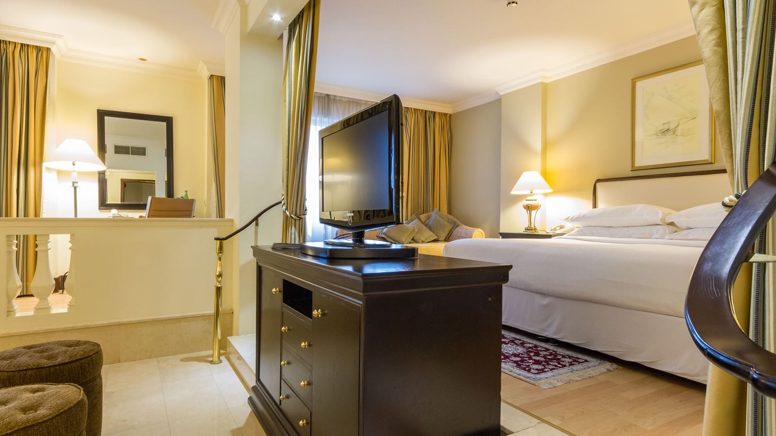 rooms-executive-room-our-executive-suites-are-stunning-and-show-attention-to-details-in-every-aspect-elevates-you-to-a-higher-level-of-suite-experience-indulge-yourself-with-our-fifty-eight-square-meters-suite-with-an-impressively-grand-bathroom-suited-for-traveler-requiring-the-highest-standards-lcd-flat-screen-tv-kind-size-bed-and-spacious-living-room-you-will-feel-like-a-royalty-when-staying-in-this-suite-and-will-find-that-all-your-needs-have-been-met-with-our-tasteful-and-sophisticated-inclusions