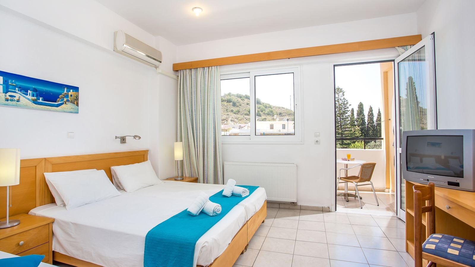 rooms-triple-room-garden-view-with-balcony